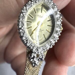 Estate Dufante Lucien Piccard Gold and Silver Quartz Diamond chip Watch